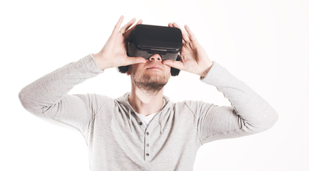 Man using virtual reality headset at whiteの写真素材