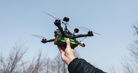 Man holds in his hand fpv copter