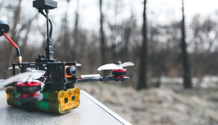 A small self made FPV drone lies on the table before the flight.の写真素材