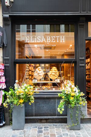 A shop window with vase of meringues in it.のeditorial素材