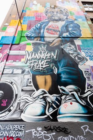 Graffiti on the wall near the Manneken Pis Statue in Brussels, Belgiumのeditorial素材