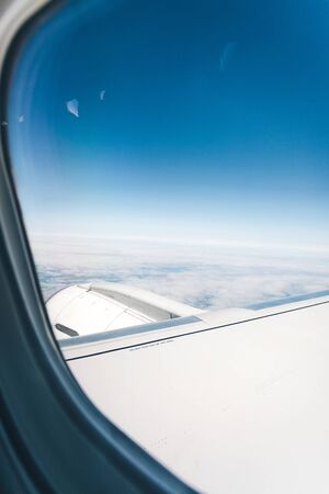 Wing aircraft in altitude during flightの写真素材