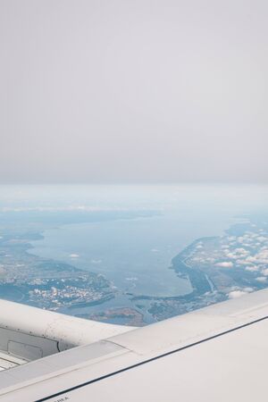 Wing aircraft in altitude during flightの写真素材