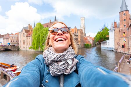 Woman tourist sightseeing Bruges, Belgiumの写真素材