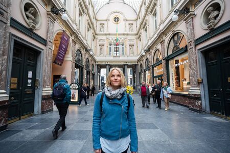 Woman in a shopping gallery with a beautiful glass dome in Brussels, Belgium.のeditorial素材