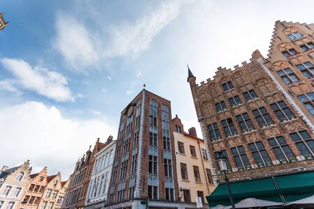 View of traditional Flemish houses in the Grote Markt square or Market Square in Bruges, Belgiumの写真素材