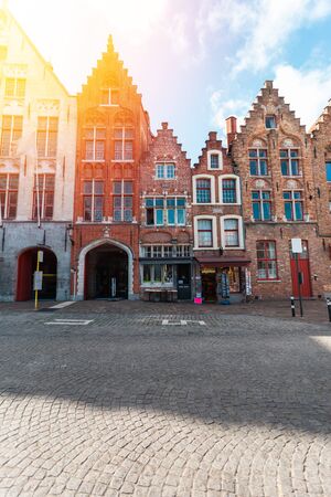 Facades of red brick houses in the traditional Dutch style in the historical center of Bruges, Belgium.の写真素材