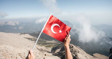 Flag of Turkey against the backdrop of Taurus Mountainsの写真素材