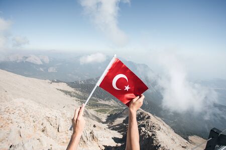 Flag of Turkey against the backdrop of Taurus Mountainsの写真素材