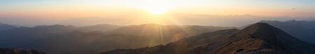 Panoramic view of the mountain landscape during twilight at sunset. Mountain silhouettes. View from Mount Tahtali near Kemer to Taurus Mountains, Turkeyの写真素材