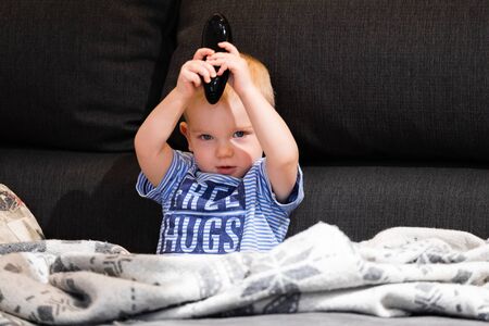 Little boy watching tvの写真素材