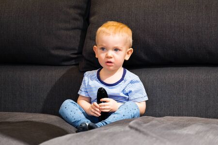 Little boy watching tvの写真素材