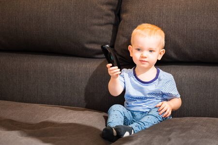 Little boy watching tvの写真素材