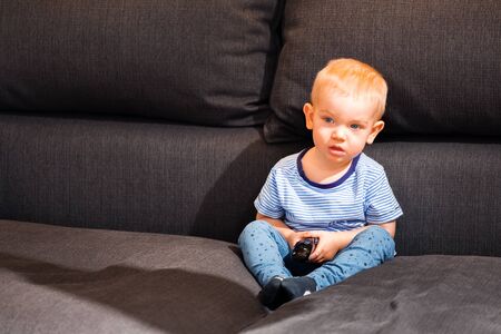 Little boy watching tvの写真素材