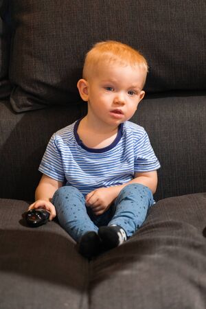 Little boy watching tvの写真素材