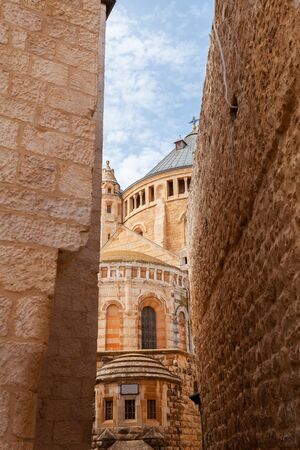 View of a fragment of the Franciscan Monastery in Jerusalem from a narrow street, Israelの写真素材