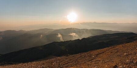Panorama of the mountains at sunset.の写真素材