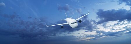 Airplane in the cloudy sky. Aircraft Flight Conceptの写真素材