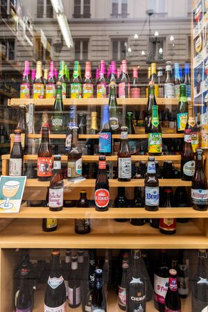 Different sorts and brands of Belgian beer in a shop windowのeditorial素材