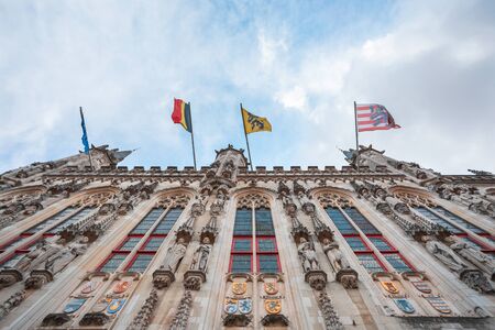 Facade of the Bruges Town Hall on Burg Square in Belgiumの写真素材