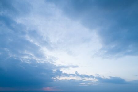 Beautiful sky with stretched clouds during twilight.の写真素材