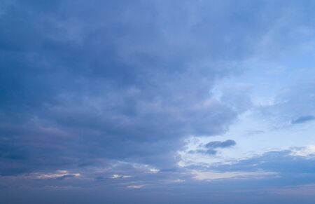 Beautiful sky with stretched clouds during twilightの写真素材