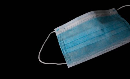 Medical mask isolated on blackの写真素材