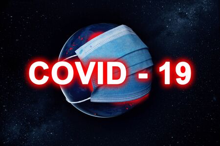 Concept Earth with a protective mask during a Covid-19 epidemic or coronavirus.の写真素材