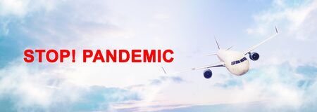 Large sky panorama with flying airplane and the inscription Stop Pandemic.の写真素材