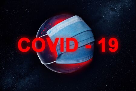 Concept Earth with a protective mask during a Covid-19 epidemic or coronavirus.の写真素材