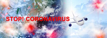 Large sky panorama with flying airplane and the inscription Stop Coronavirus.の写真素材