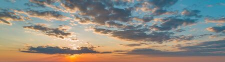 Large panorama with beautiful sunset sky and beautiful cloudsの写真素材