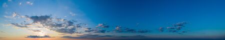 Large panorama with beautiful sunset sky and beautiful cloudsの写真素材