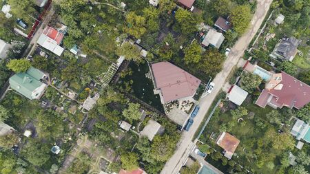 Top view of the village with private houses at sunset. Aerial view.の写真素材