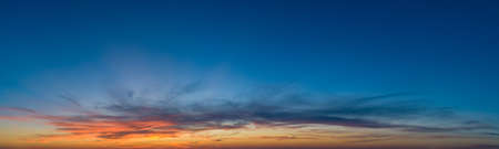 Large panorama with sunset sky with multicolor cloudsの写真素材