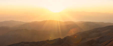 Panorama of the mountains at sunset.の写真素材