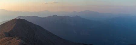 Big panorama of the mountains at sunset, twilightの写真素材