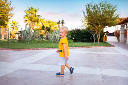 A boy walks through the territory of a luxury hotelのeditorial素材