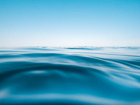 Skyline with blue sky and underwater part with sea and waves.の写真素材