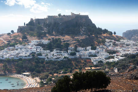 Panoramic view of the old town of Lindos in Greece with the acropolis on top of the hill.の写真素材
