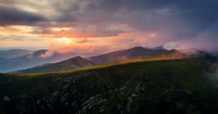 Panorama of mountains at sunset after rainの写真素材