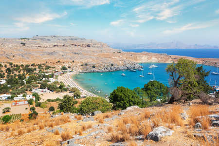 View from the hill of the Acropolis on the Mediterranean coast in the city of Lindos, Rhodes island, Greeceの写真素材