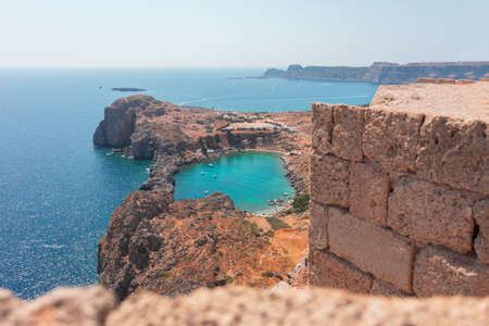 Panorama of the secret beach in Lindos city from the Acropolis, Rhodes island, Greeceの写真素材