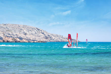 Windsurfing at the confluence of two seas on the island of Rhodes in Greeceの写真素材
