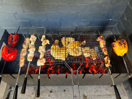 Charcoal grilling of meat and vegetables. Pork skewersの写真素材