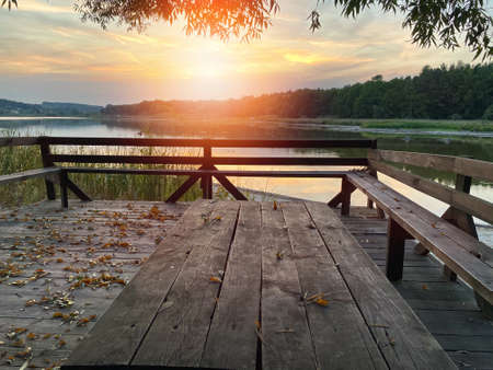 Autumn landscape on the lake at sunsetの写真素材