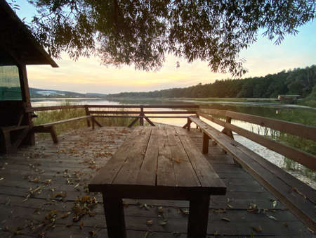 Autumn landscape on the lake at sunsetの写真素材