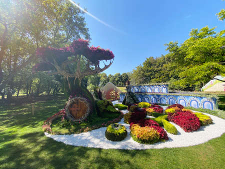 Cartoon character figurines made from flowers in the parkの写真素材