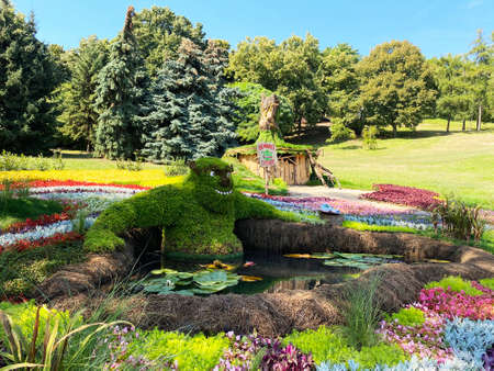 Cartoon character figurines made from flowers in the parkの写真素材