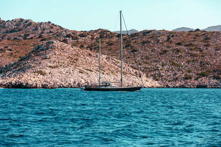 View of the island from the sea from a passing ship, Greece.